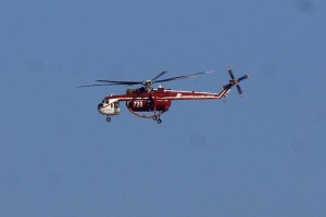 Day 25, September 19 - a water-dropping heli-tanker flies over the BFS on the way to the Station Fire.