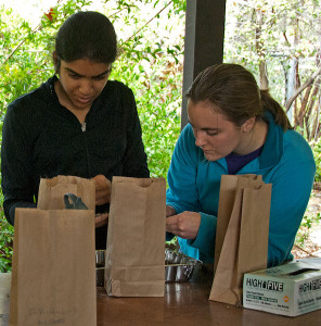Megan Wheeler (right) helps volunteer Thendral Govindraj (HMC '16) sort one of her many litter samples for carbon analysis.