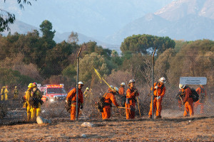 6:48 PM - Fire crews work to put out hot spots in the East Field. Nancy Hamlett.