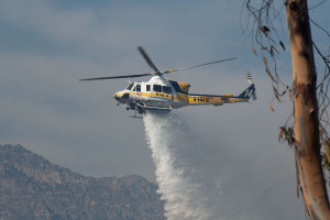 4:36 PM - A Bell 412 water-dropping helicopter drops its load on the BFS. Nancy Hamlett.