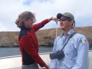 Kristen measuring Eduardo Prieto, the biologist from Guadalupe Island, Mexico, for the 200m dowel markings. SBI is in the background.  