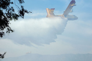 4:49 PM - A Canadair Super Scooper dumps a load of water on the fire.  Nancy Hamlett.