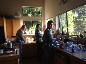 Jim Weigand from the BLM cooking with Sophie and Ramon in the the Hichwa's kitchen. 
